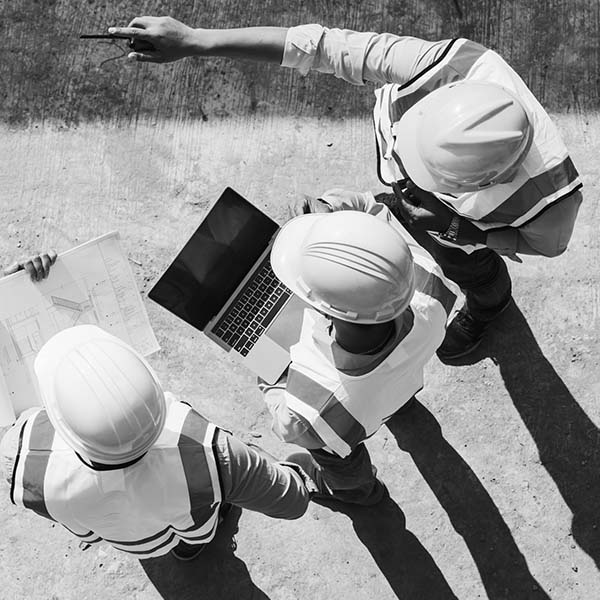 Contractors studying construction job | Wellons Construction