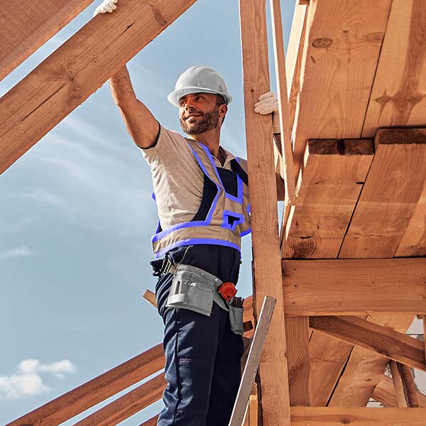 Home builder leaning on beams | Wellons Homes Division