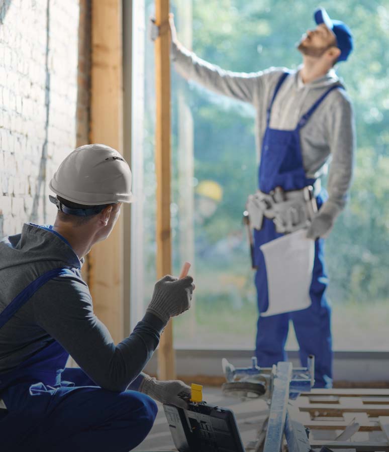 Two contractors studying interior