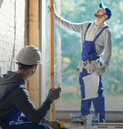 Two contractors studying interior